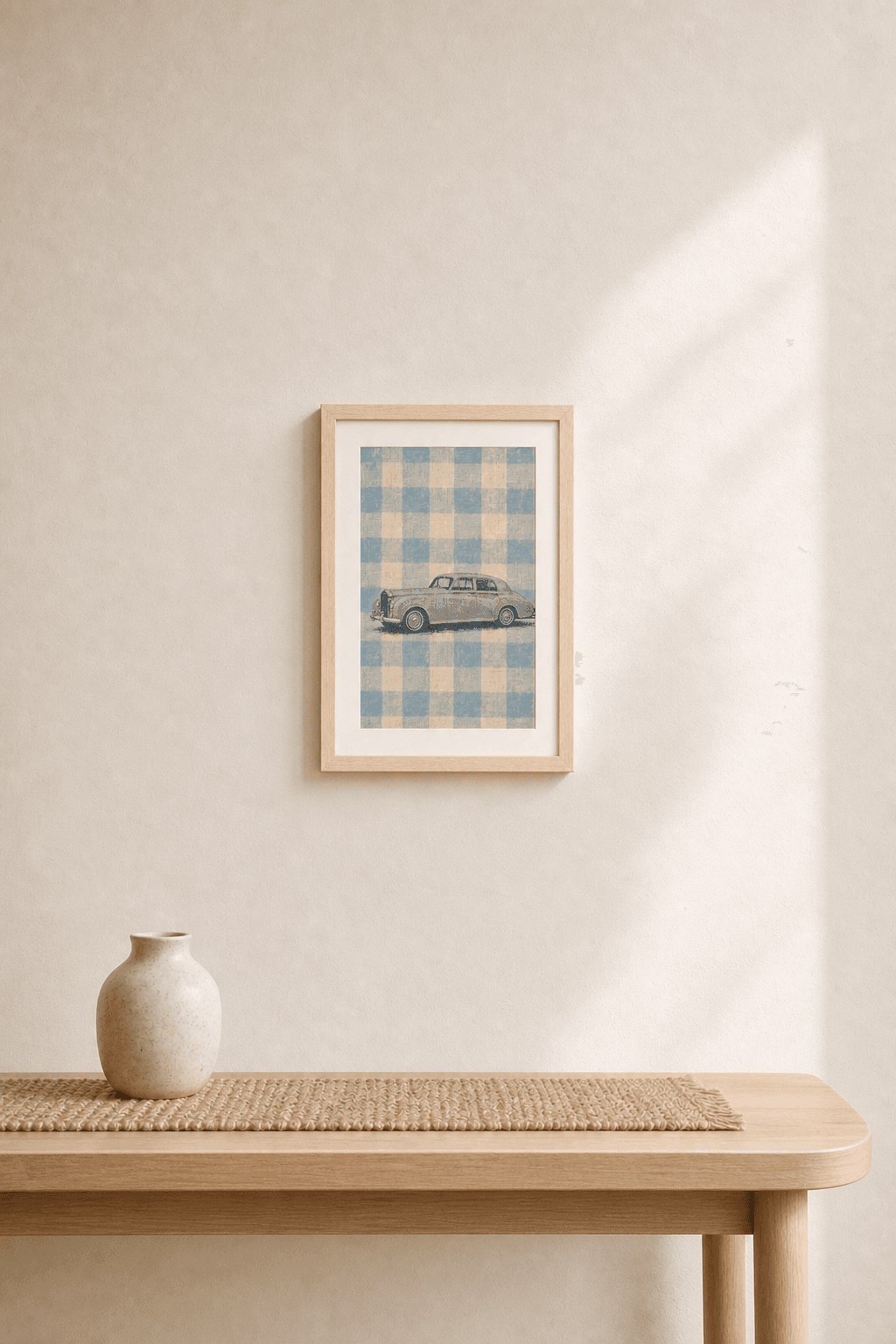 Rolls-Royce Silver Cloud III artwork displayed in a natural maple frame in a warm, neutral interior