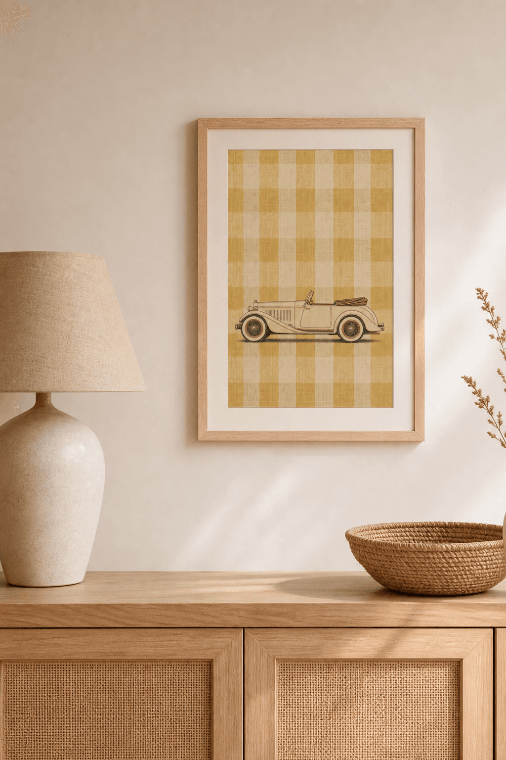 Duesenberg J artwork displayed in a natural maple frame in a warm, neutral interior