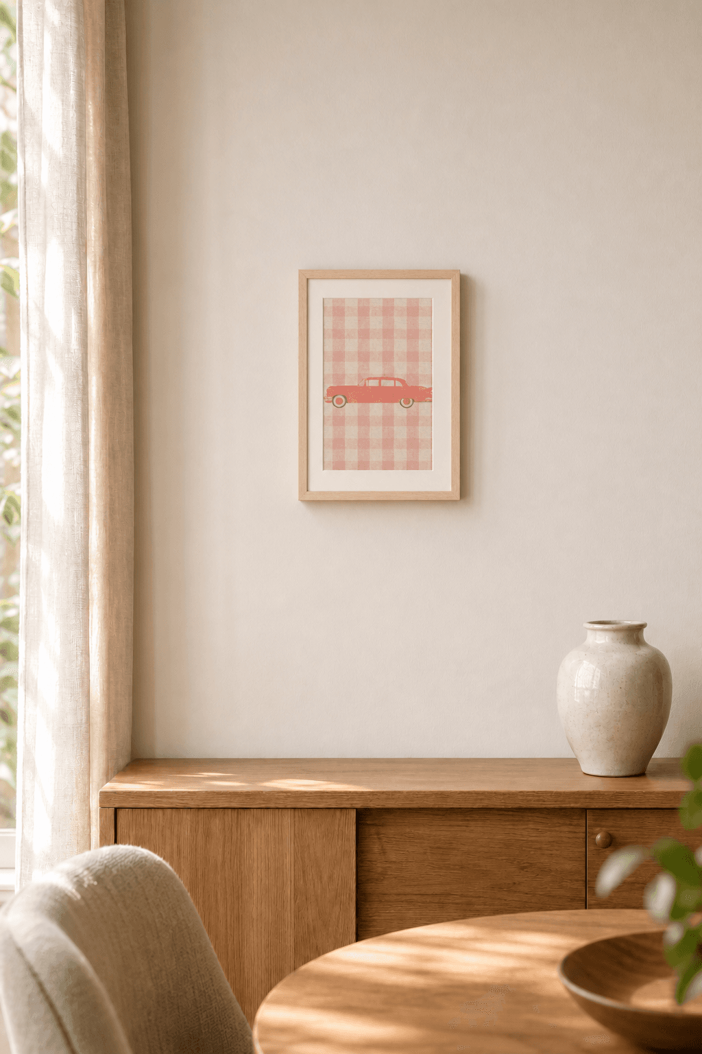Cadillac Fleetwood 75 artwork displayed in a natural maple frame in a warm, neutral interior