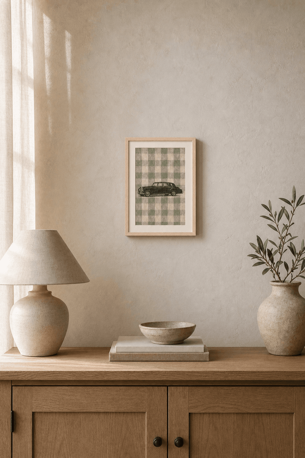 Rolls-Royce Phantom V artwork displayed in a natural maple frame in a warm, neutral interior